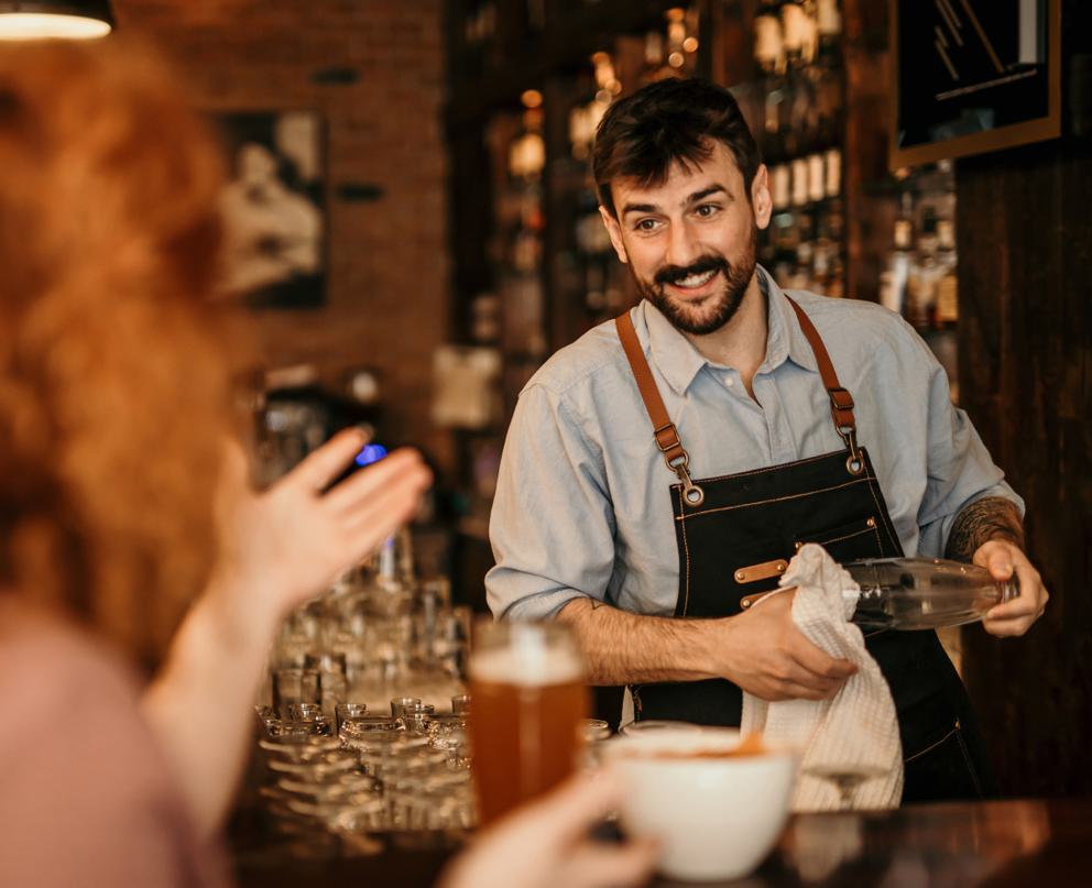 Barman drying glasses